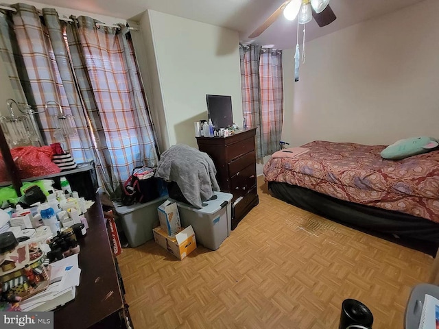 bedroom with light parquet flooring and ceiling fan