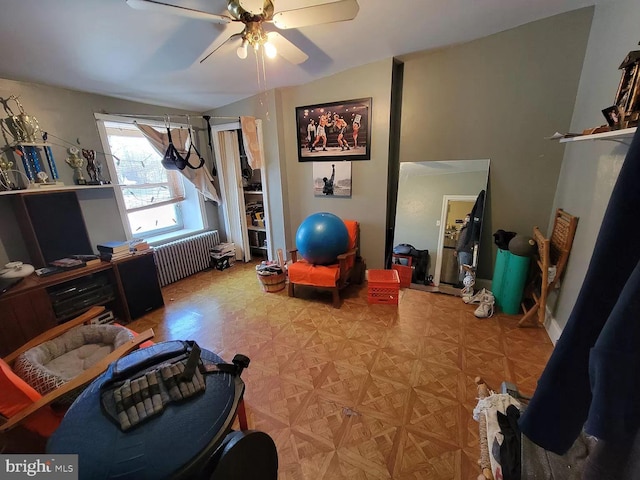 workout area featuring light parquet flooring and ceiling fan