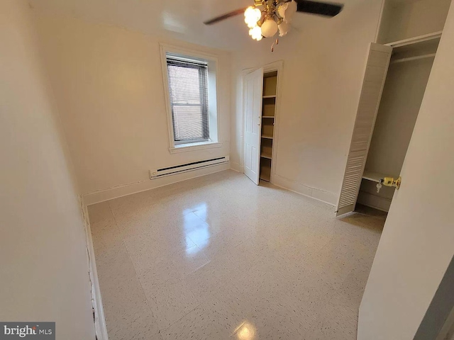 unfurnished bedroom with a baseboard heating unit and ceiling fan