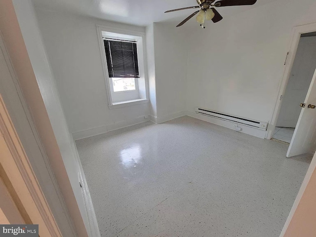 empty room featuring a baseboard radiator and ceiling fan