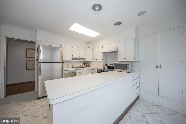 kitchen featuring kitchen peninsula, ornamental molding, stainless steel appliances, extractor fan, and white cabinets