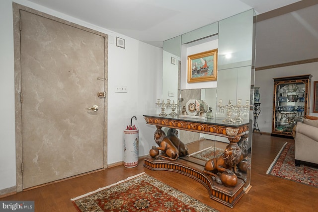 entryway with dark hardwood / wood-style floors