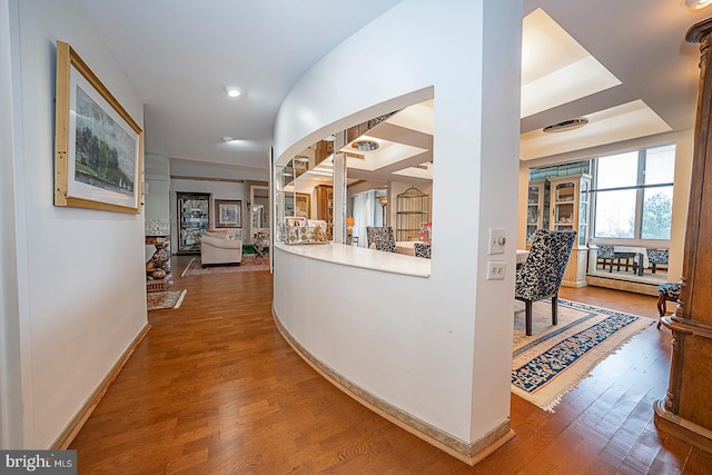 hallway with hardwood / wood-style flooring