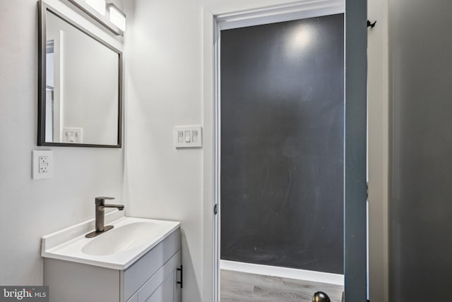 bathroom featuring vanity and wood finished floors