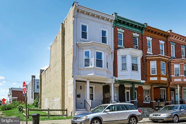 view of property featuring brick siding