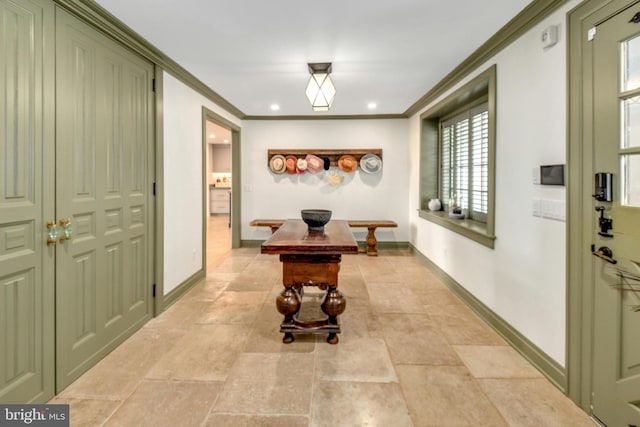 hallway featuring ornamental molding, recessed lighting, and baseboards