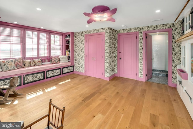 interior space featuring ceiling fan and hardwood / wood-style flooring