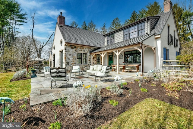 back of house with a patio and an outdoor hangout area