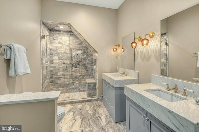 bathroom featuring tile patterned floors, a shower with door, vanity, and toilet