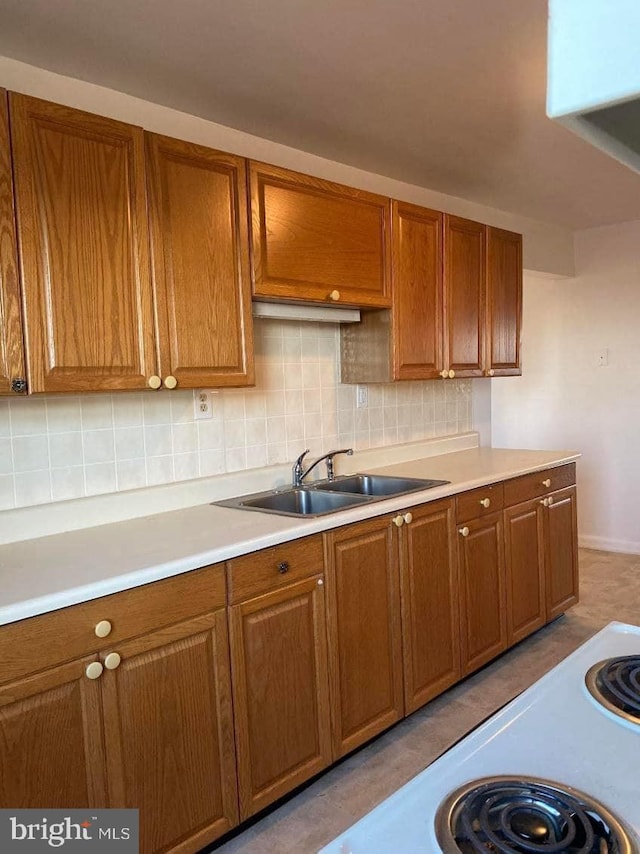 kitchen with tasteful backsplash and sink