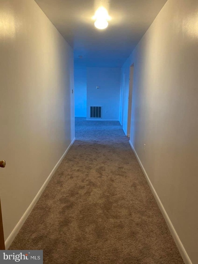 hallway with light carpet