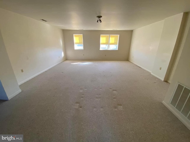 unfurnished room featuring carpet flooring