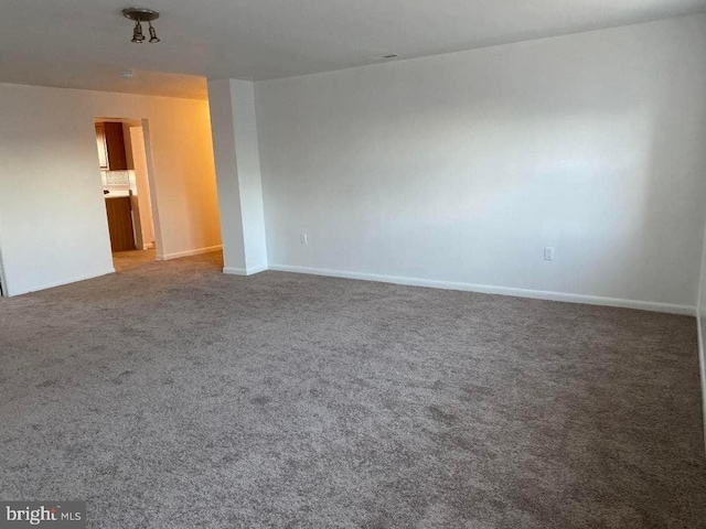 spare room featuring carpet floors