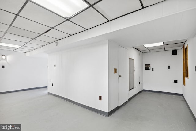 hall featuring a paneled ceiling