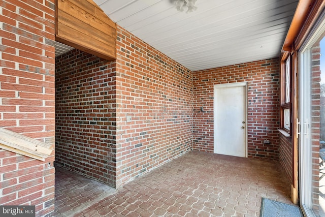 unfurnished sunroom featuring a wealth of natural light