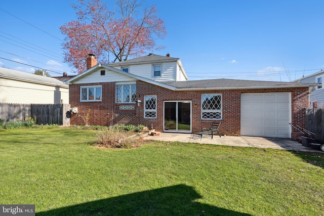 view of front facade with a front yard and a garage