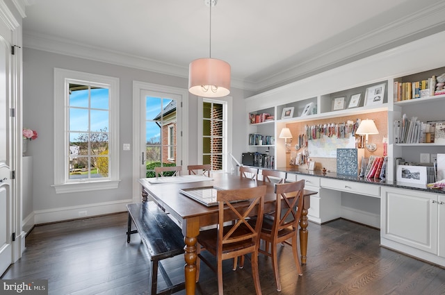 dining room with crown molding and dark wood-type flooring