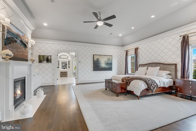 bedroom with dark hardwood / wood-style floors, ceiling fan, and lofted ceiling