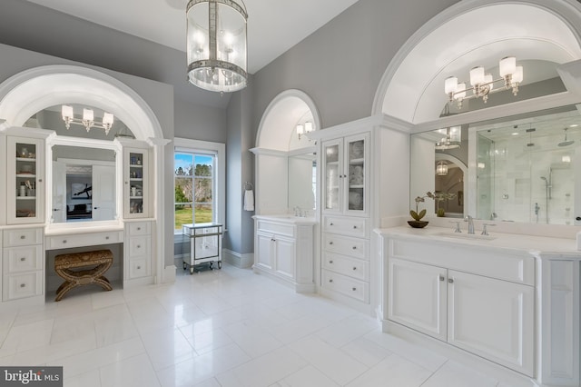 bathroom featuring walk in shower, vanity, high vaulted ceiling, tile patterned flooring, and a chandelier