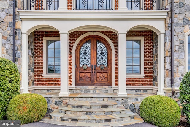 property entrance with french doors and a porch