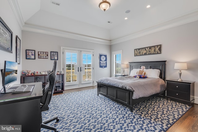 bedroom featuring dark hardwood / wood-style flooring, crown molding, access to outside, and french doors