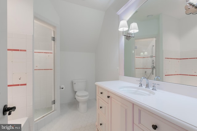 bathroom featuring tile patterned flooring, vanity, toilet, and walk in shower