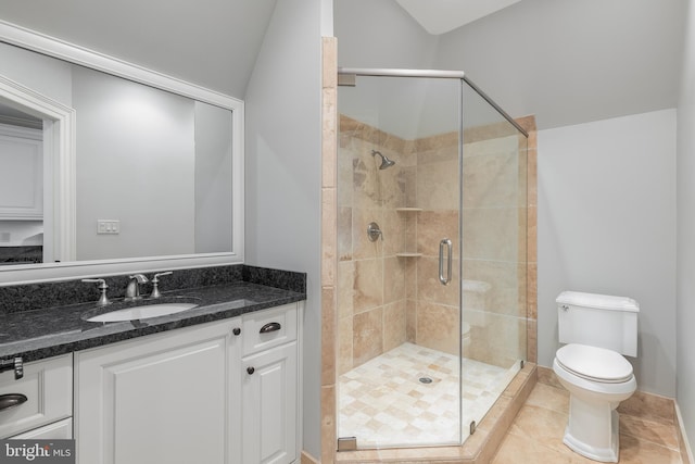 bathroom featuring tile patterned flooring, lofted ceiling, toilet, a shower with door, and vanity