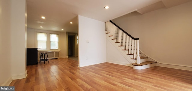 stairway featuring light hardwood / wood-style floors