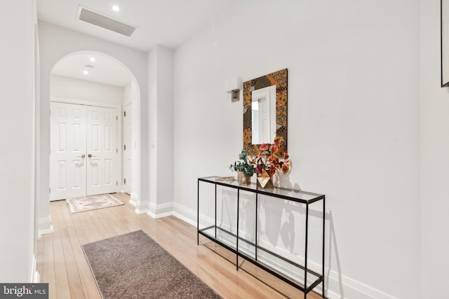 hallway with light hardwood / wood-style flooring