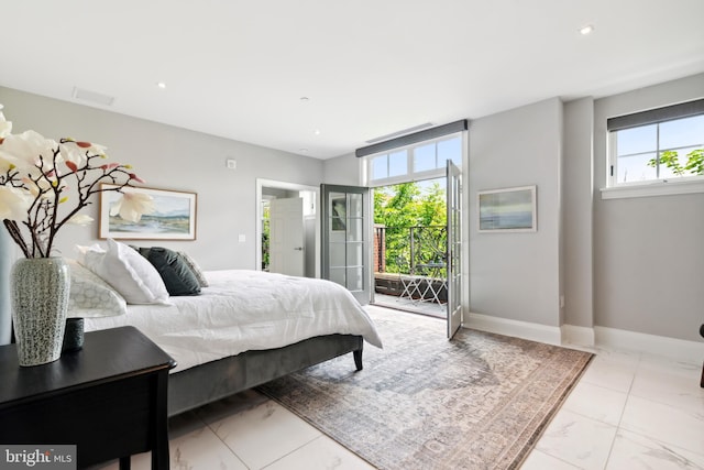 tiled bedroom with multiple windows and access to outside