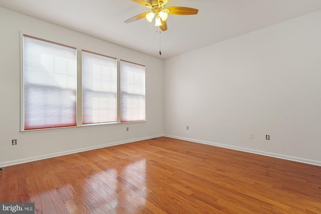 unfurnished room with ceiling fan and light hardwood / wood-style flooring