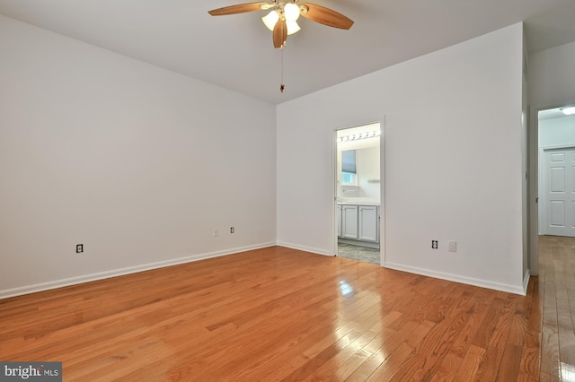 unfurnished room featuring light hardwood / wood-style floors and ceiling fan