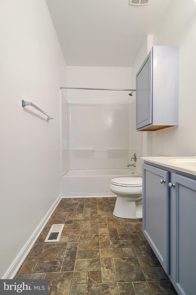 full bathroom featuring tile floors, shower / washtub combination, toilet, and vanity