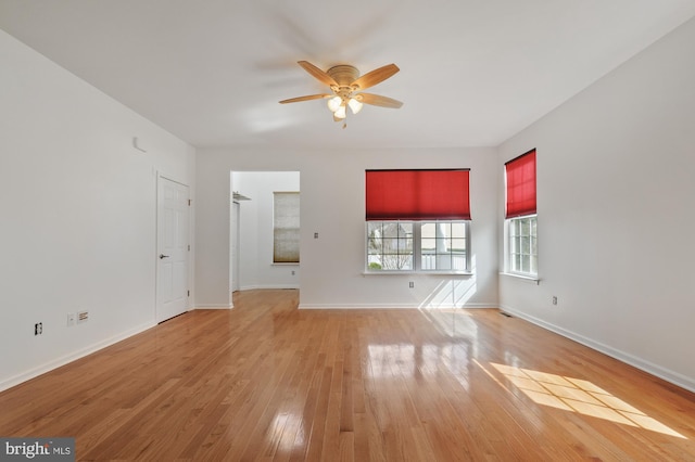 spare room featuring ceiling fan and light hardwood / wood-style flooring