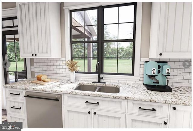 kitchen featuring decorative backsplash, dishwasher, sink, and white cabinets