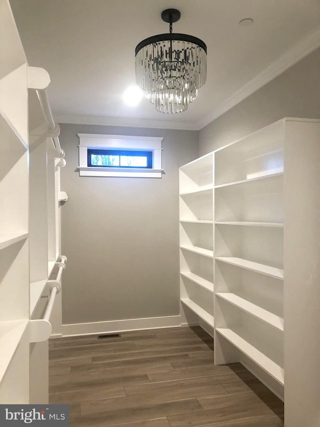 interior space with a chandelier and dark wood-type flooring