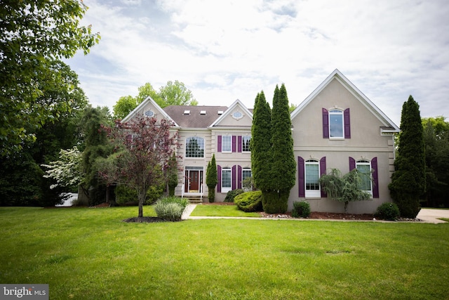 view of front of property with a front lawn