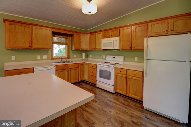 kitchen featuring wood-type flooring, sink, white appliances, and vaulted ceiling