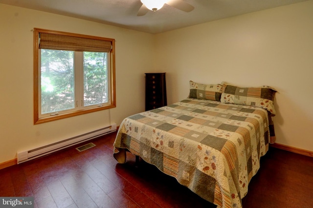 bedroom with ceiling fan, a baseboard radiator, and dark hardwood / wood-style flooring