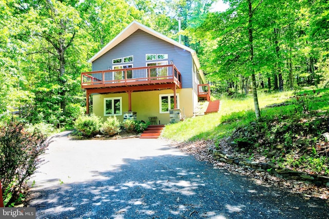 view of front of property with a wooden deck