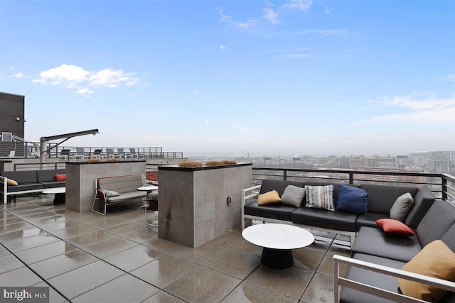 view of patio with a balcony and an outdoor hangout area