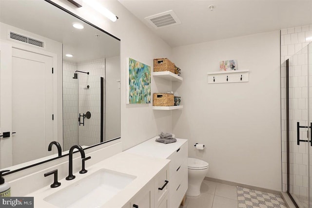 bathroom featuring toilet, tile flooring, vanity, and an enclosed shower