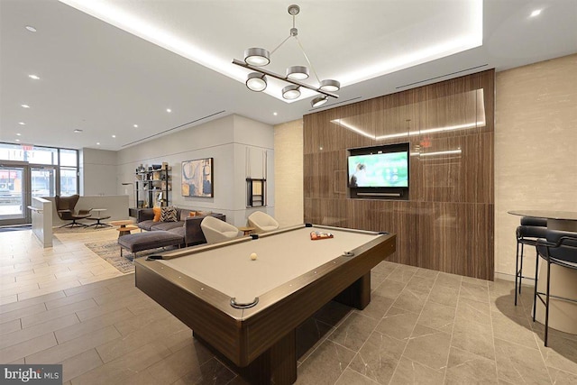 game room featuring billiards, light tile floors, and tile walls