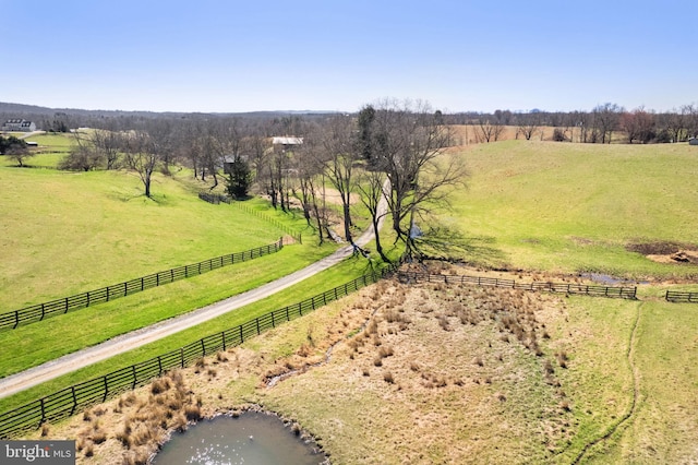 drone / aerial view with a rural view and a water view