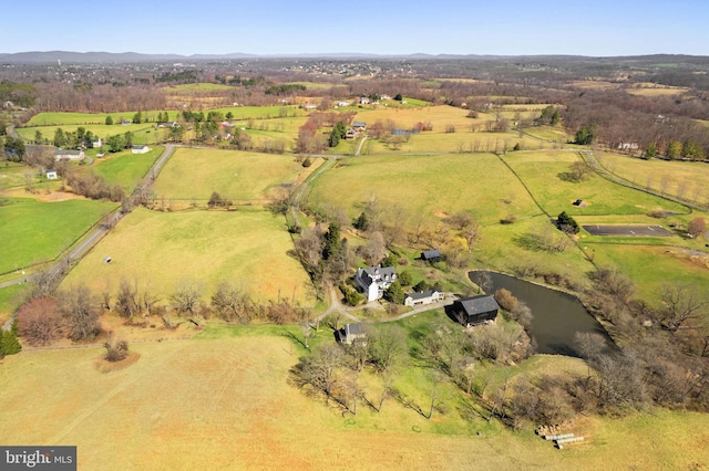 birds eye view of property with a rural view and a water view