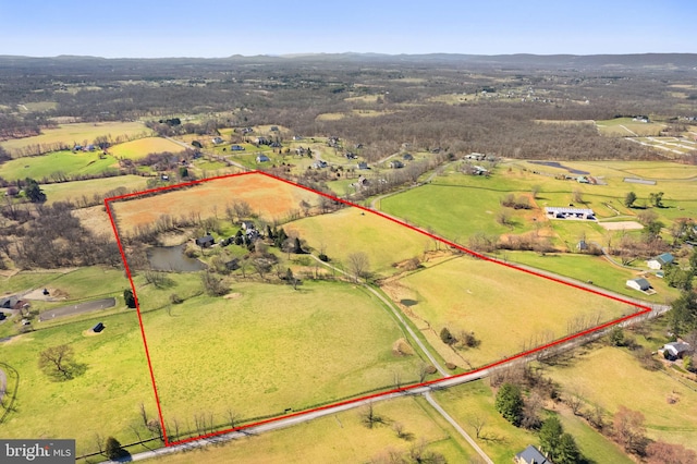 birds eye view of property featuring a rural view