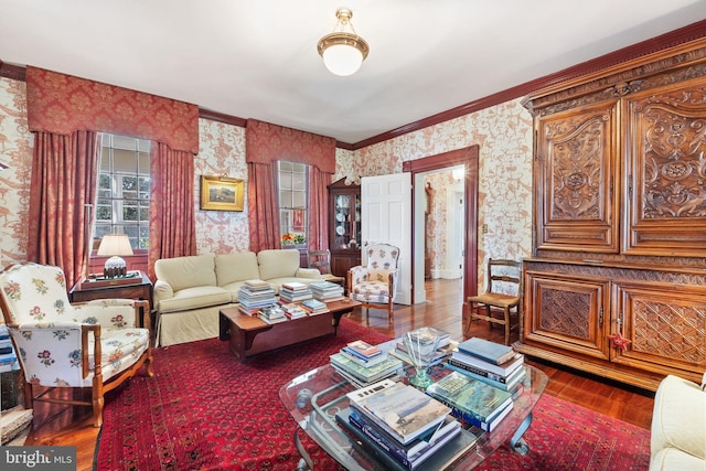 living room with crown molding and hardwood / wood-style floors