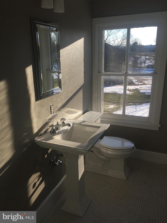 bathroom featuring tile patterned flooring and toilet