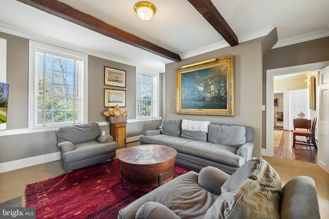 living room with beamed ceiling and ornamental molding