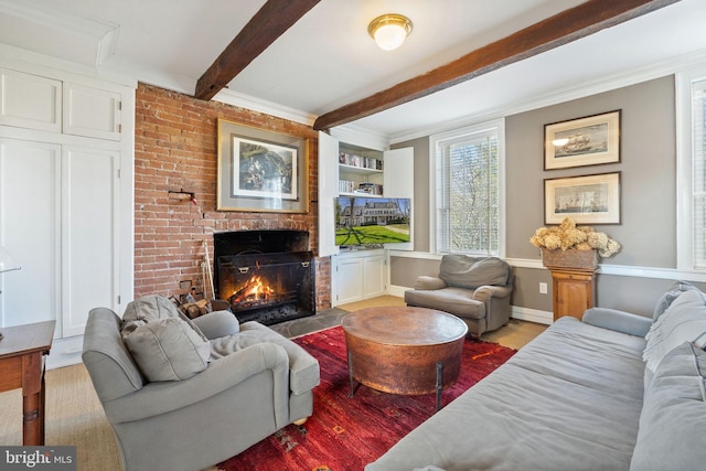 living room with beamed ceiling, built in features, hardwood / wood-style floors, and a brick fireplace